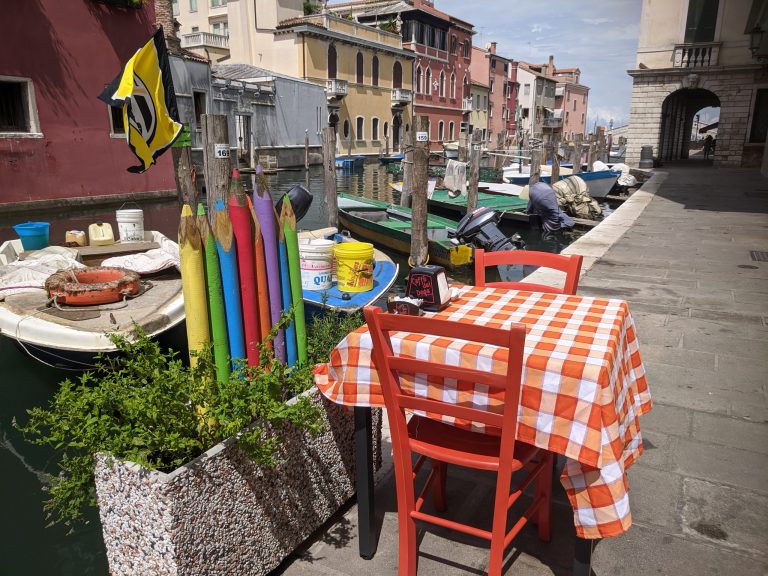 Canal side eating, Venice with kids