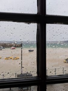 View of Harbour Beach from pub in rain, St Ives beaches