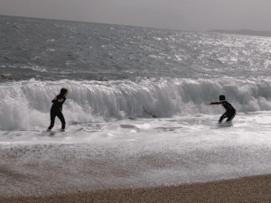 Boy in waves, Blackpool Sands, Devon, UK,, travel tales