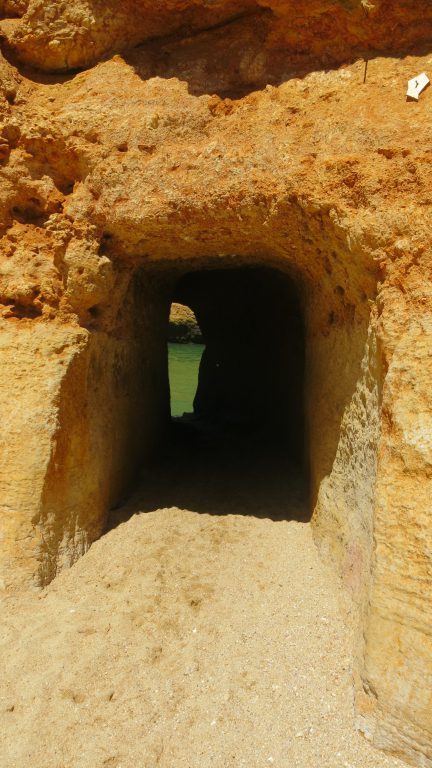 Secret tunnel at Dona Ana beach, Lagos, Portugal with kids