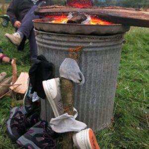 Socks drying on fire, gift ideas for campers