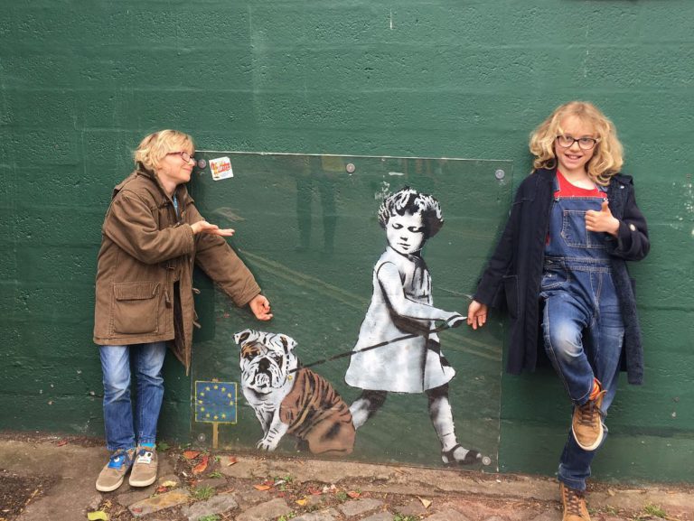 Girl walking dog, street art, things to do in Bristol with kids in lockdown