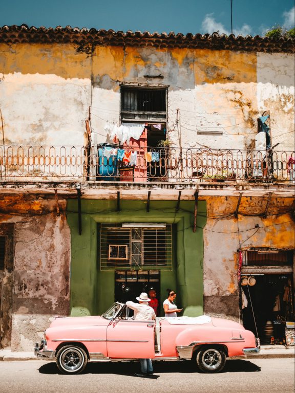 Car in front of old building Cuba