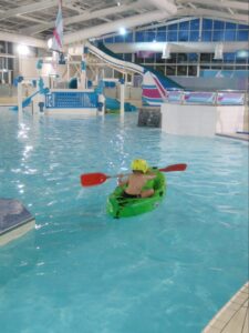 Canoeing in pool, Devon cliffs holiday park, caravan holidays