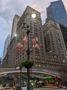 USA flags, Grand Central Station, New York with teens